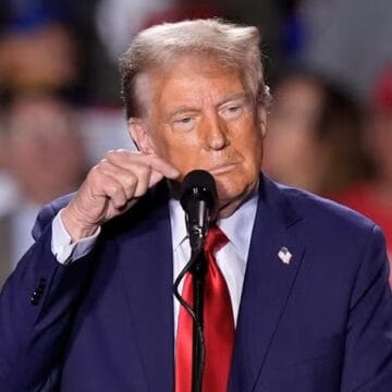 Trump paces for 18 minutes after mic goes out before launching into usual rants during Detroit rally