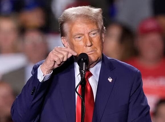 Trump paces for 18 minutes after mic goes out before launching into usual rants during Detroit rally