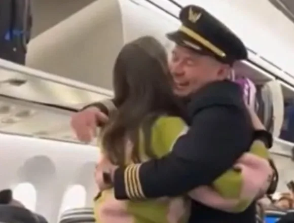 United pilot warmly embraces his bone marrow donor after learning she was a passenger on his flight