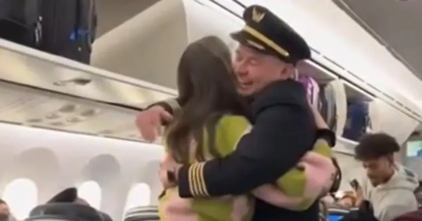 United pilot warmly embraces his bone marrow donor after learning she was a passenger on his flight