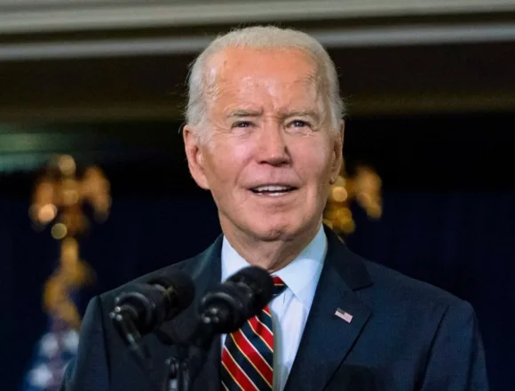 Biden signs defense bill despite objections to ban on transgender health care for military children
