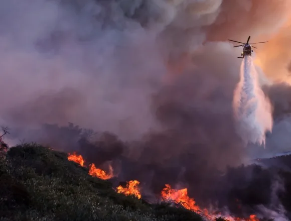 Flames engulf Southern California as crews battle to control Palisades Fire
