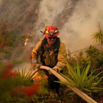 Firefighters battle to contain L.A. fires as Santa Ana winds are forecast to pick back up