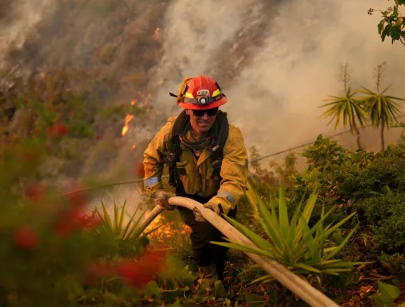 Firefighters battle to contain L.A. fires as Santa Ana winds are forecast to pick back up