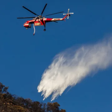 Hughes Fire containment grows after thousands forced to flee