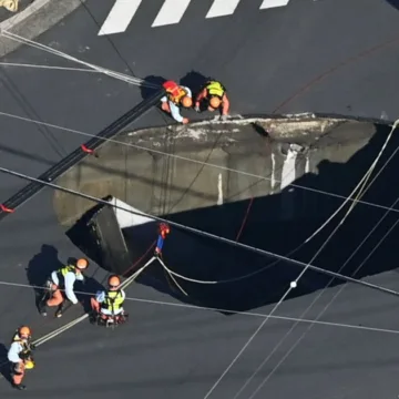 Swimming pool-sized sinkhole swallows truck in Japan, trapping driver inside