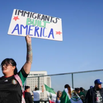 Marchers protesting planned deportations block major freeway in Los Angeles