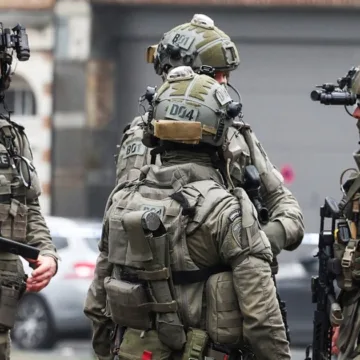 Belgian police hunt for armed gunmen after shooting in Brussels