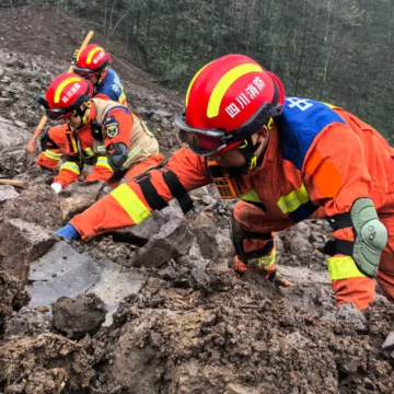 Rescuers recover 1 body and search for 28 people in a landslide in southwest China