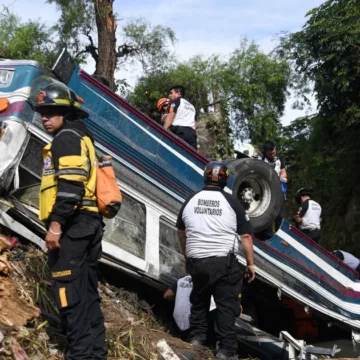At least 50 die in Guatemala after bus plunges off bridge