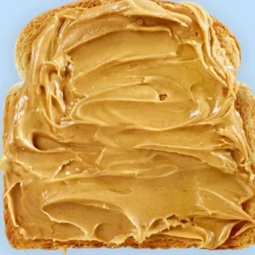 Children with mild peanut sensitivity may be able to use store-bought peanut butter to overcome it, study finds