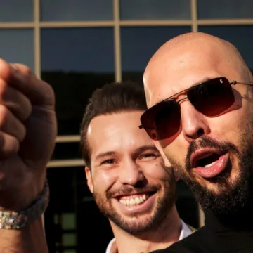 Andrew Tate, charged with rape in Romania, heads to U.S.