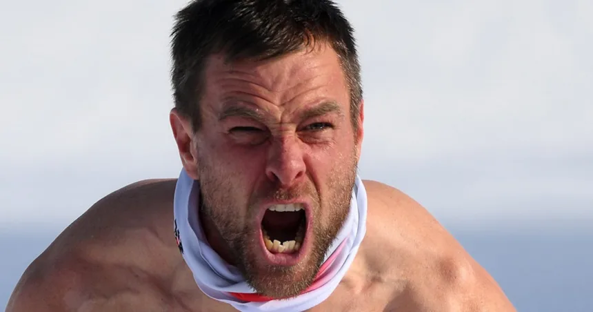 Austria’s Karl celebrates split-second win bare-chested