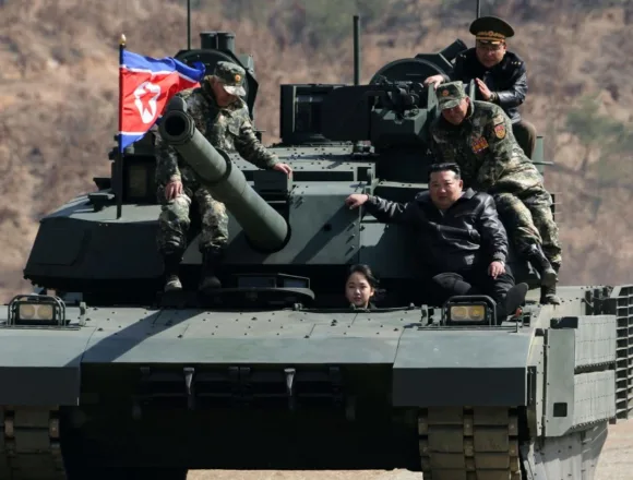 260319-north-korea-vsb-2328-9dc1e7.jpg North Korean leader Kim and his daughter ride a tank together during army training