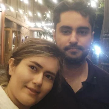 As an Iranian couple mourns the loss of their newborn, the travel ban keeping them apart adds to the pain