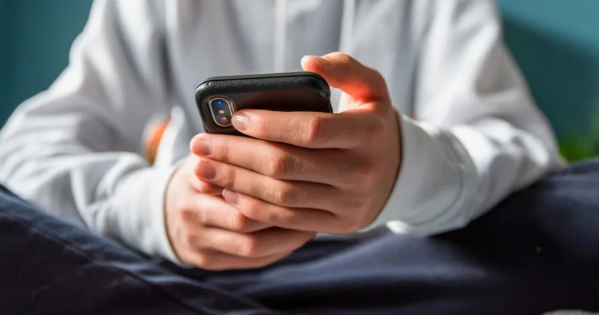 260120-teen-on-phone-gk-f32f4c.jpg Age verification is coming for the internet — and it’s already raising red flags