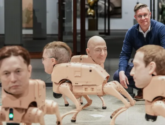 Robot dogs with Musk and Zuckerberg heads roam around Berlin museum in Beeple’s new exhibit