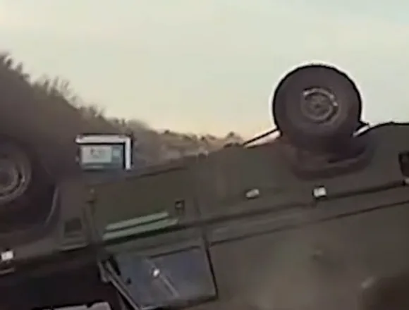 Military truck rolls over on highway in U.K.