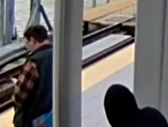 Suspect appears to push man into oncoming train path